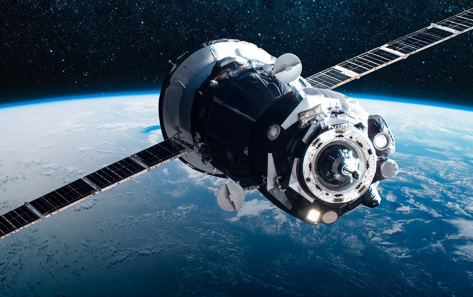 A spacecraft orbiting above the Earth